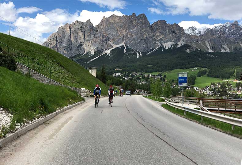 Cyclists riding out of Cortina d'Ampezzo