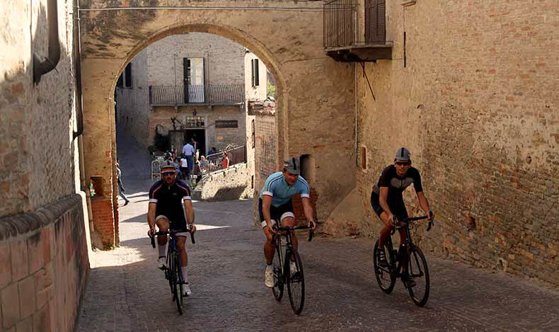 three people riding under an arch in Piedmont