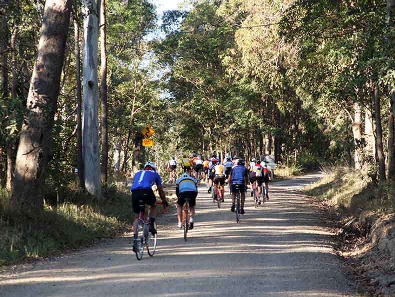 a group of riders in the countryside