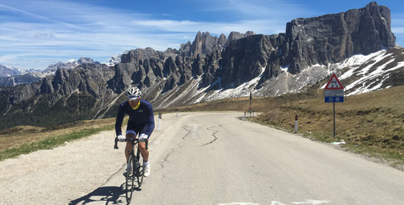 A rider cycling up to Passo Giau