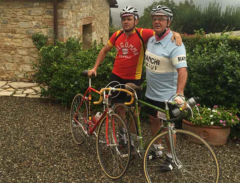 Two men and a steel bicycle at L'Eroica