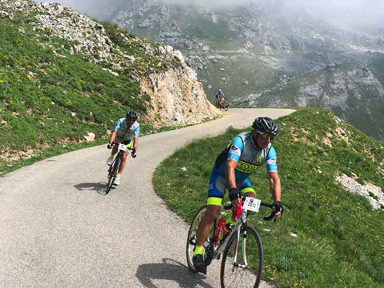 Two cyclists descending during La Fausto Coppi Gran fondo