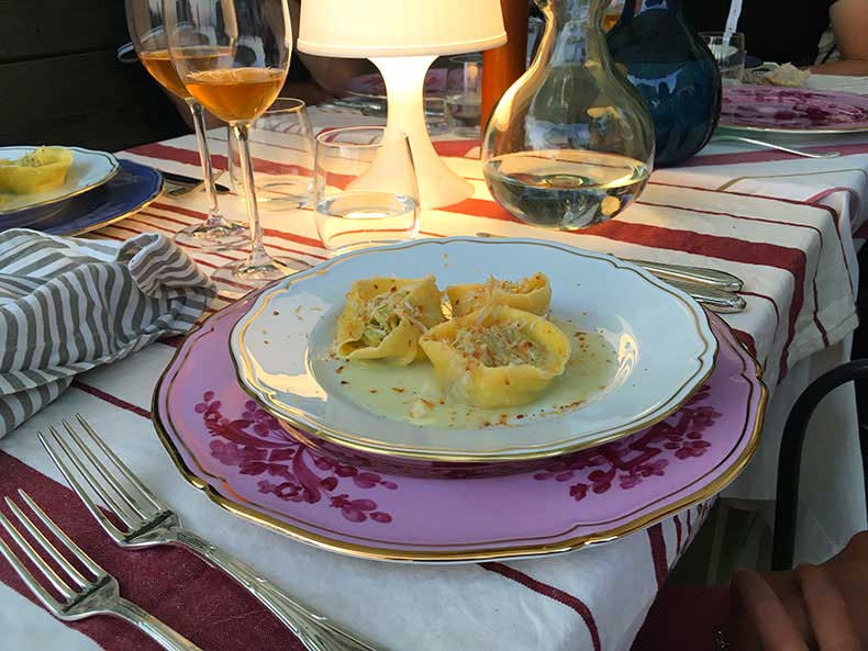 A beautiful homemade pasta and glass of wine in Asolo