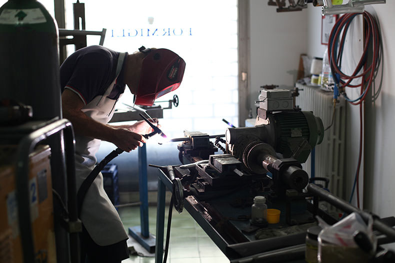 A man building a bike in Italy