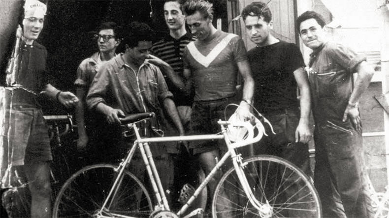 a vintage steel bicycle and cyclists