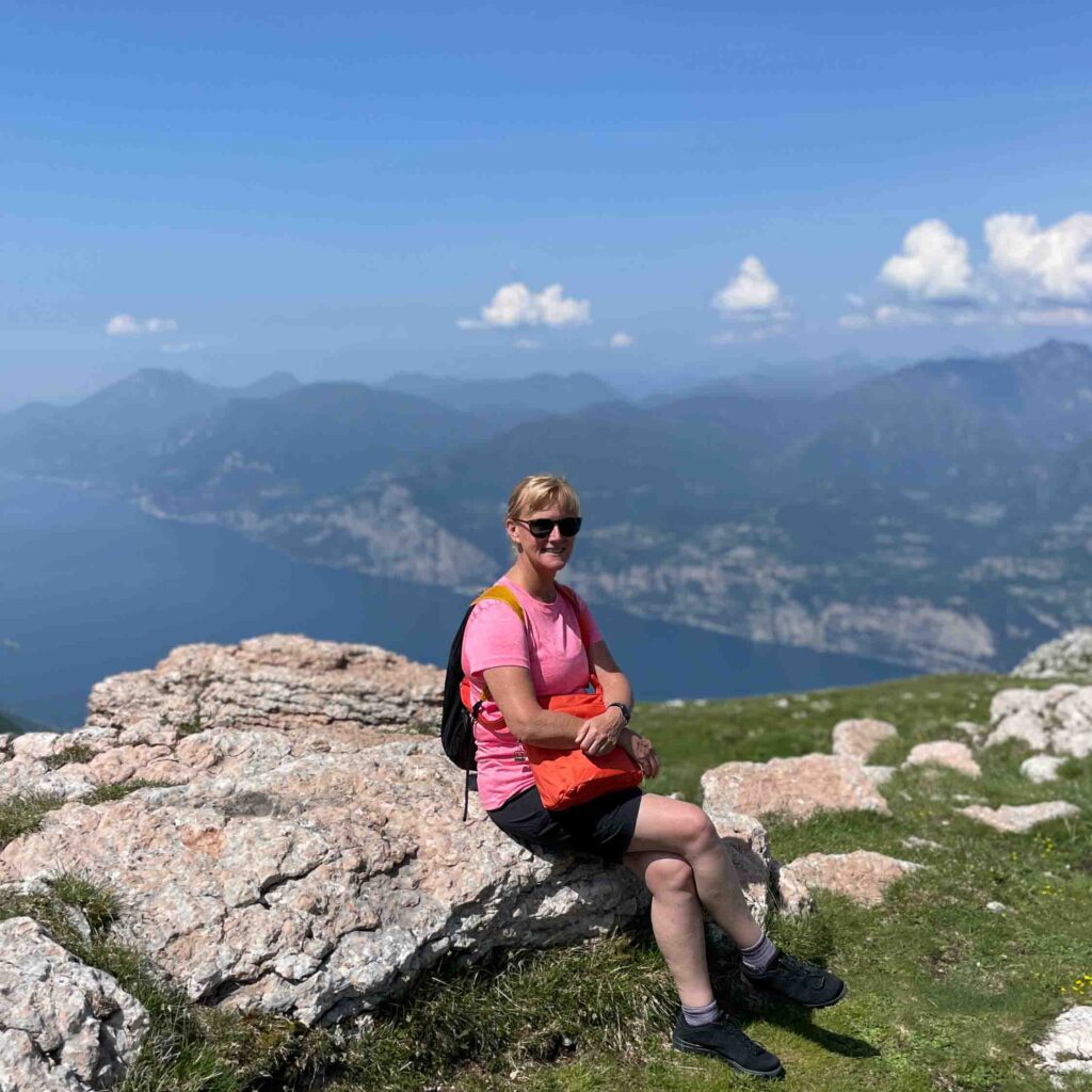 A lady at the top of a hill near Lake Ga