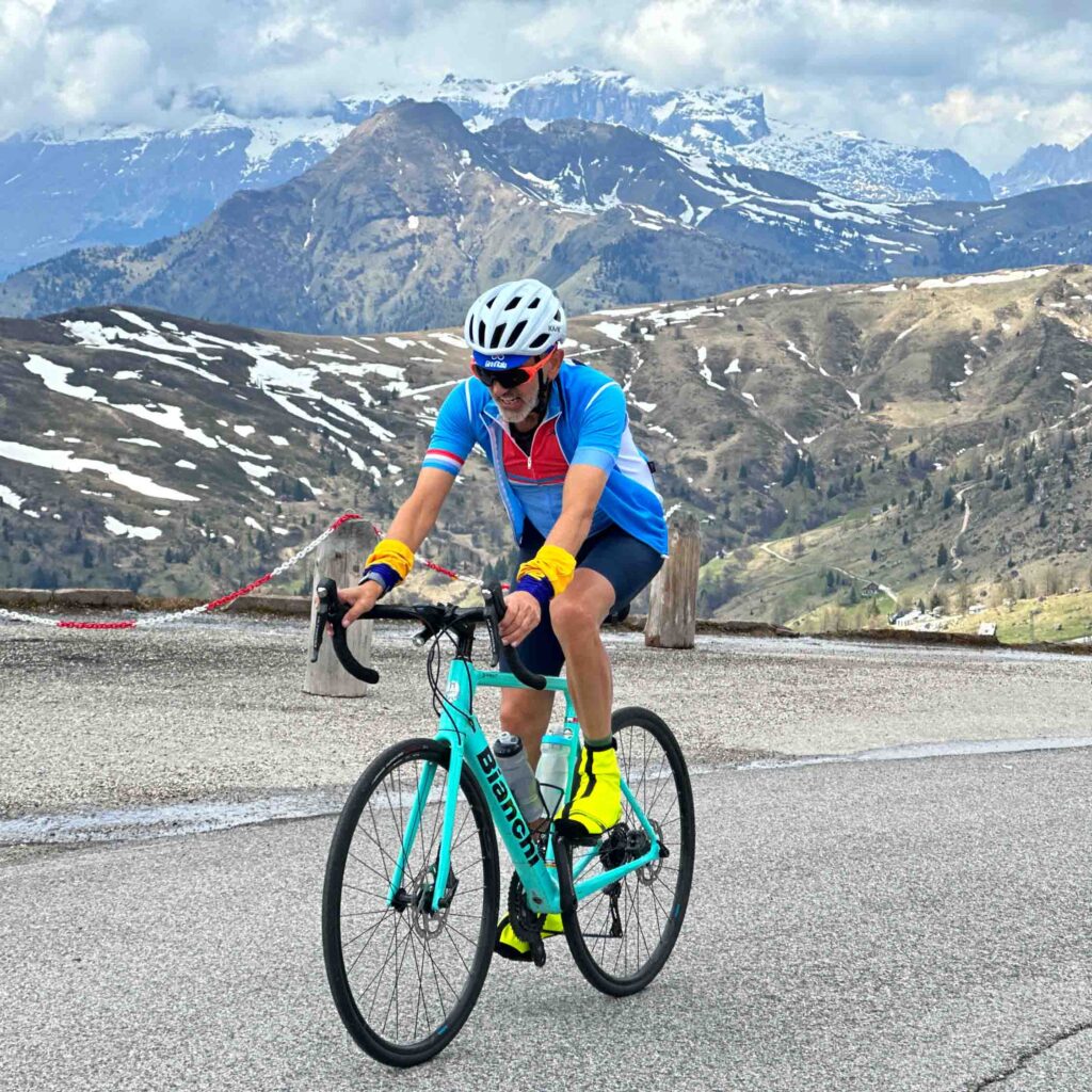 A man on a cycling holiday in the Dolomites Italy