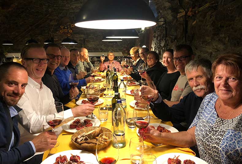 A group dinner around one table in Italy