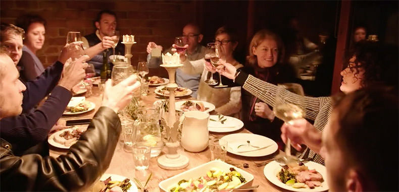 people having dinner around one table