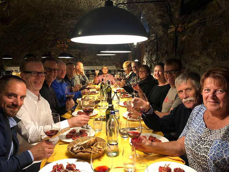 a group dinner on one long table