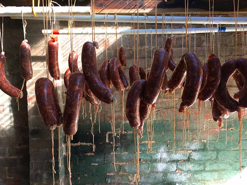 homemade salami hanging out to dry