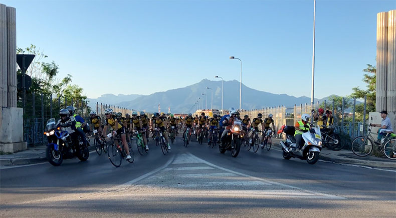 The Fausto Coppi Gran Fondo riders cycling over the Cuneo bridge