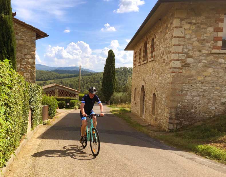 A man riding a bike in Gaiole in Chianti