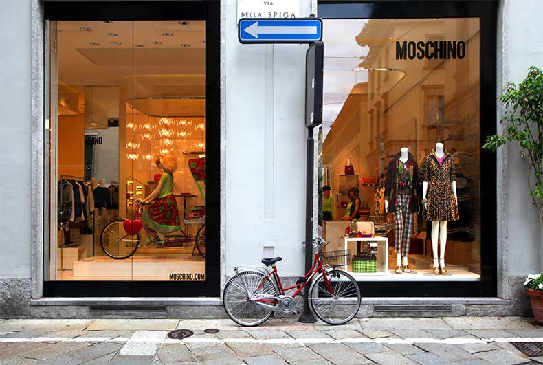 A bicycle out side a fashion shop in Milan