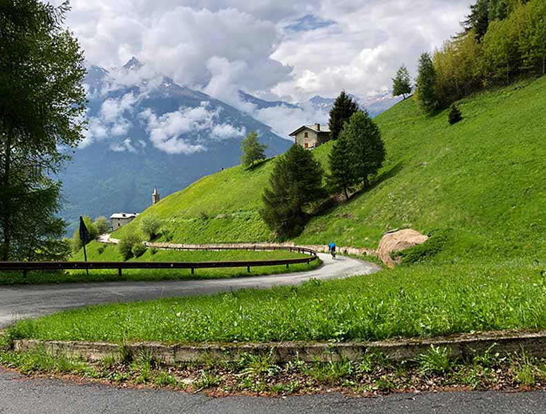 A rider cycling down the Mortirolo descent