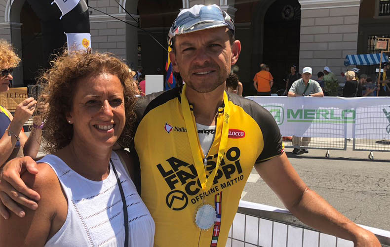 Two people at the finish line of La Fausto Coppi Gran Fondo