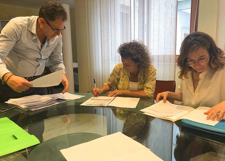 A woman signing a documnet