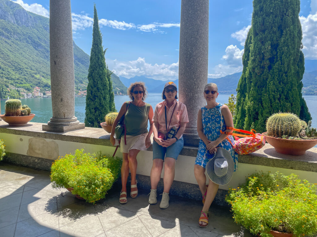 Three women at a historic villa on the edge of Lake Como