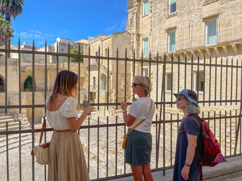 Two womens and a guide on a walking tour of Lecce Puglia