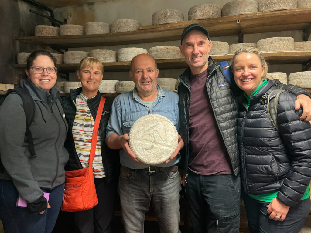 A group of people with a cheese maker near Bergamo, Italy