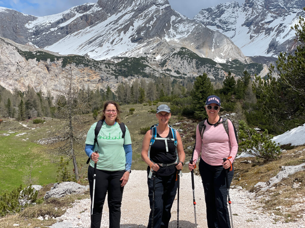 Three people hiking in the Dolomites