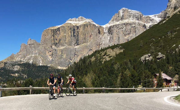 Three people riding in the Dolomites