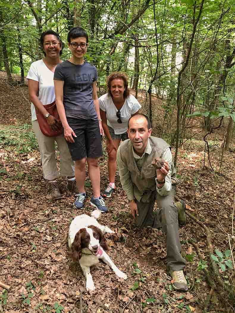 non riding partners and man and a dog on a truffle hunt on a Piemonte cycling holiday