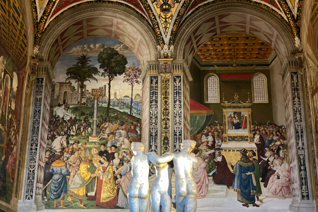 The decorative interior of a church in Siena, Italy