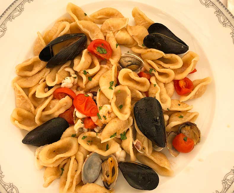 a plate of orecchiette with mussels and vongole