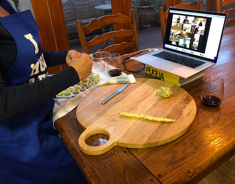 A virtual cooking lesson with a computer and chopping board