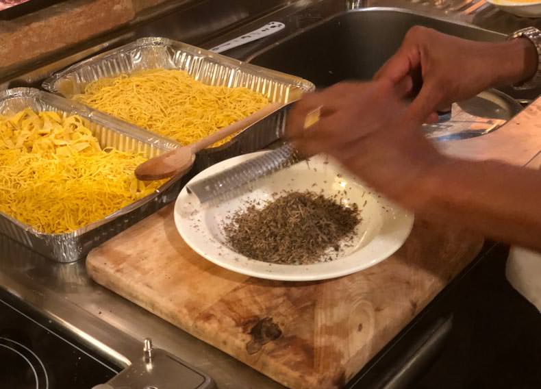 truffles being grated and fresh hand made pasta