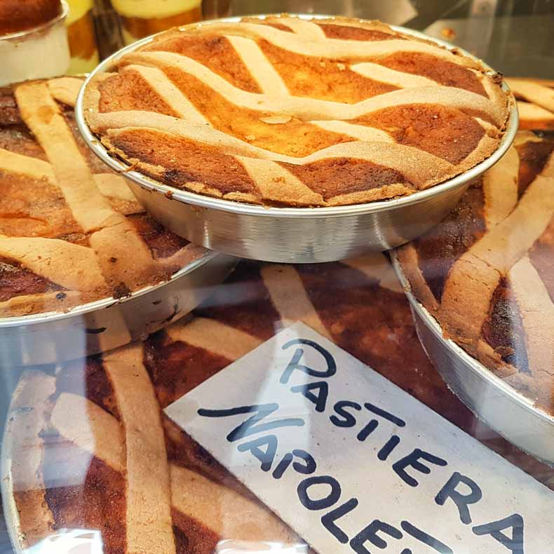 Pastiera napoletana cakes in a shop window in Naples