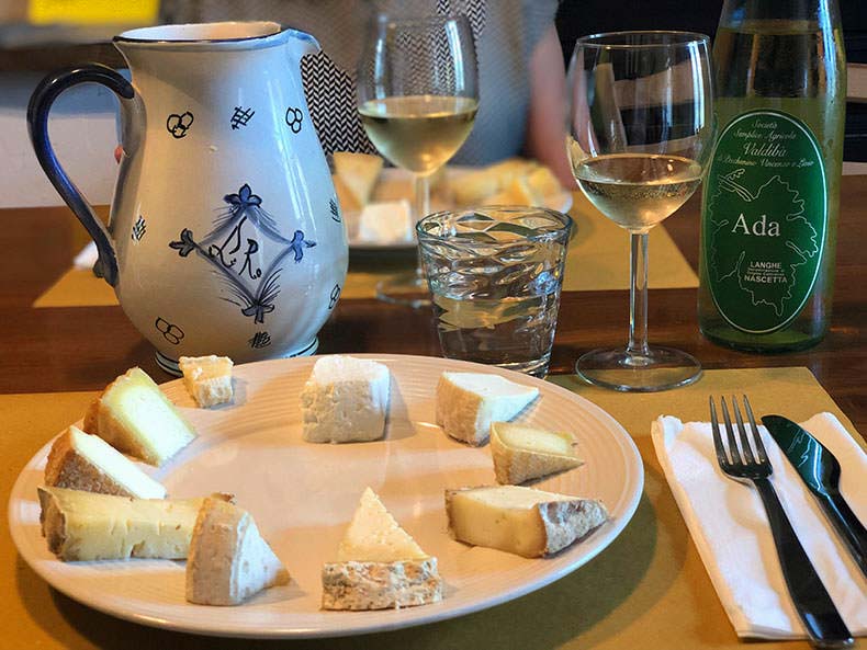 Glasses of wine and a plate of cheese