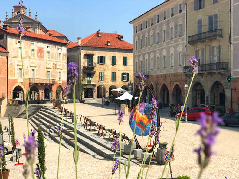 flowers and old buildings in a town in Piemonte