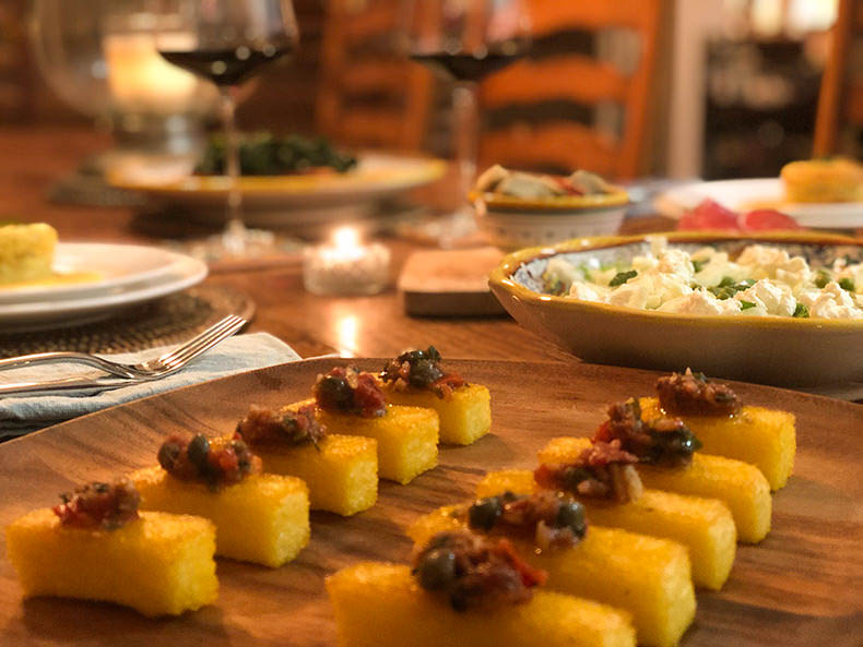 Polenta crostini with an anchovy sauce