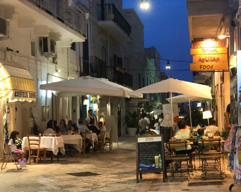 A night time streetscape of Polignano a Mare