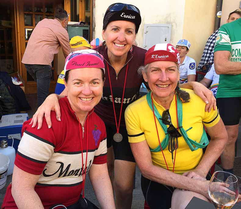 Three women in woolen jerseys who completed L'Eroica