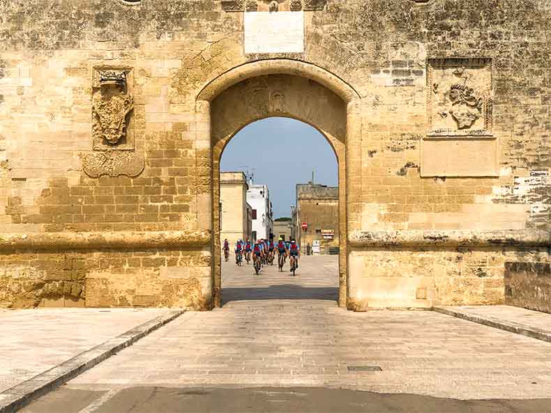 Riders in an old stone town in Puglia
