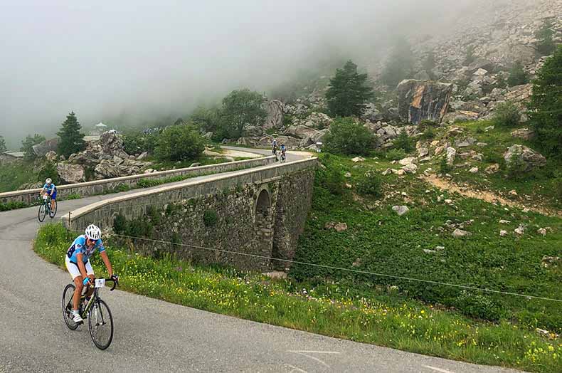 A rider cycling up colle Fauniera