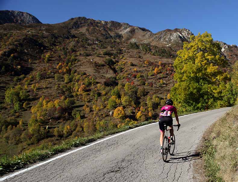 A cyclist riding up colle fauniera