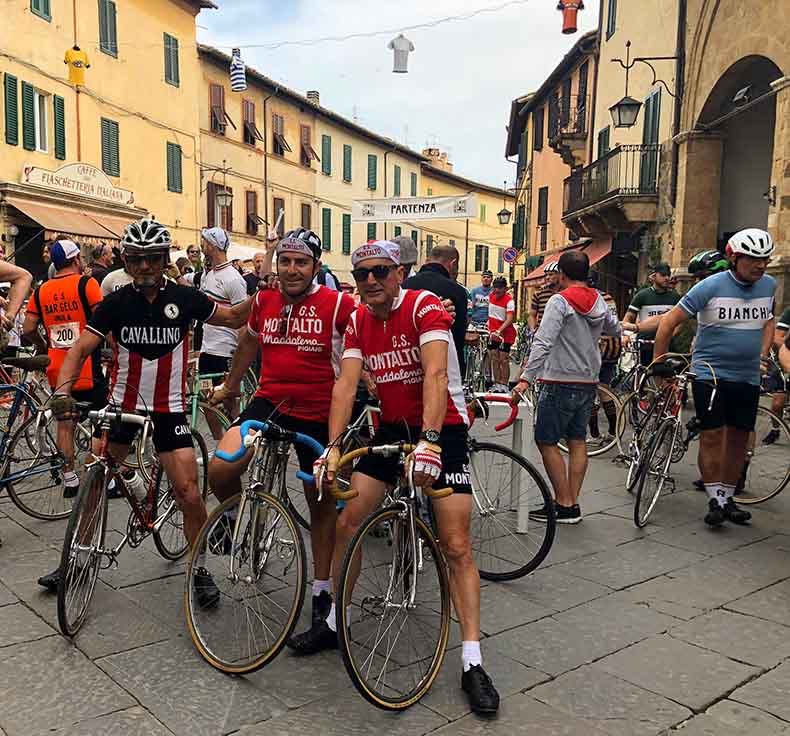 Cyclist in woolen jerseys and on steel bikes in Tuscany at L'Eroica