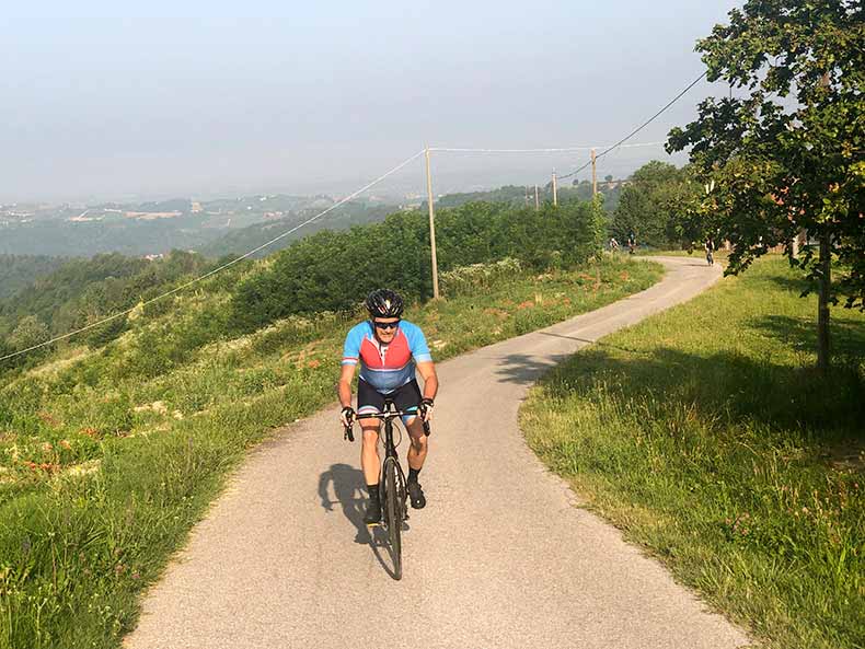 A man riding in Piemonte on a cycling holiday