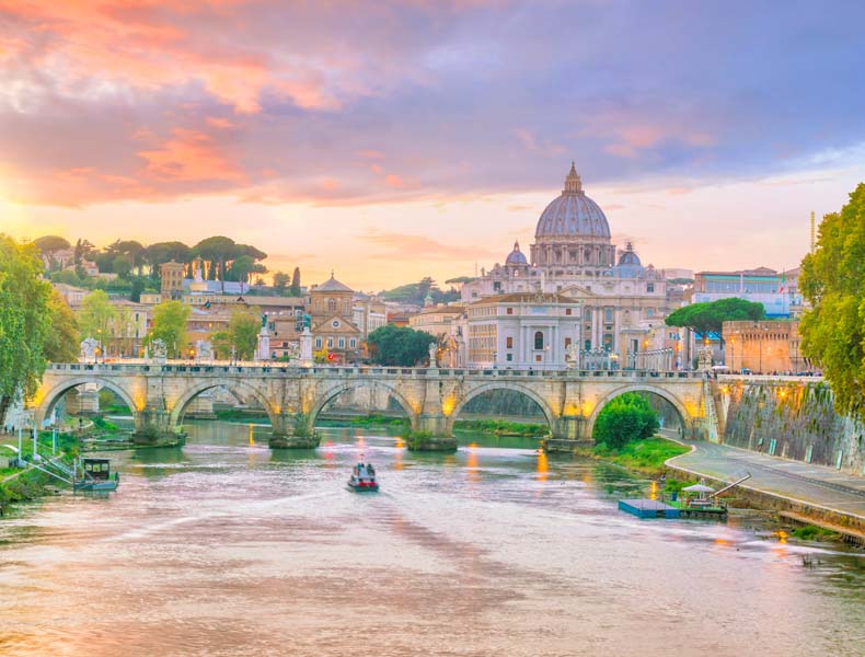 a tiber river and vatican at sunset