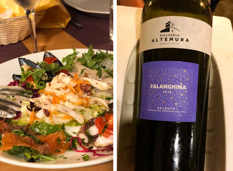 a bottle of Puglian wine and a plate of mixed seafood antipasto