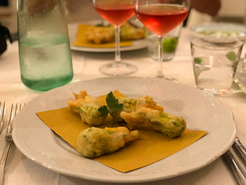 Glasses of Rosato with a plate of stuffed zucchini flowers