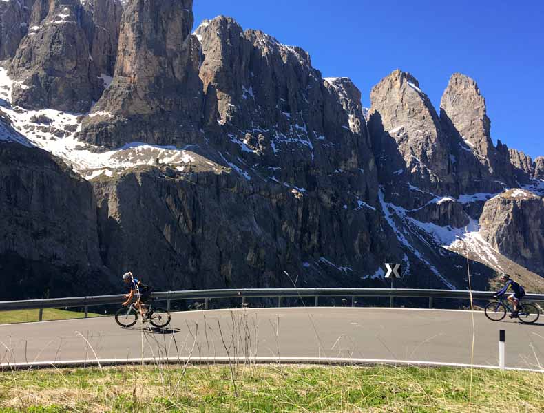 a cyclist riding the Sella Ronda loop in the Dolomites