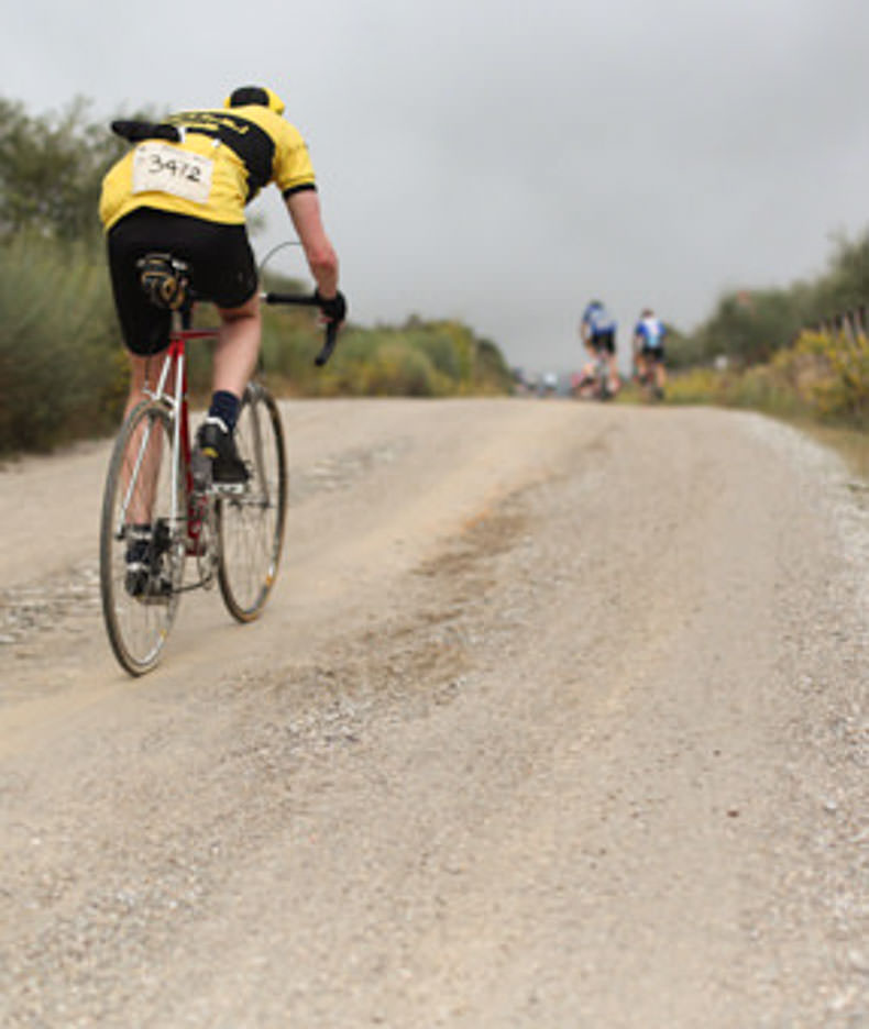 A rider at L'Eroica cycling up a hill