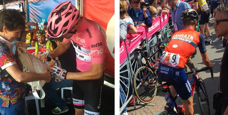The Giro leader in the pink jersey signing autographs for fans