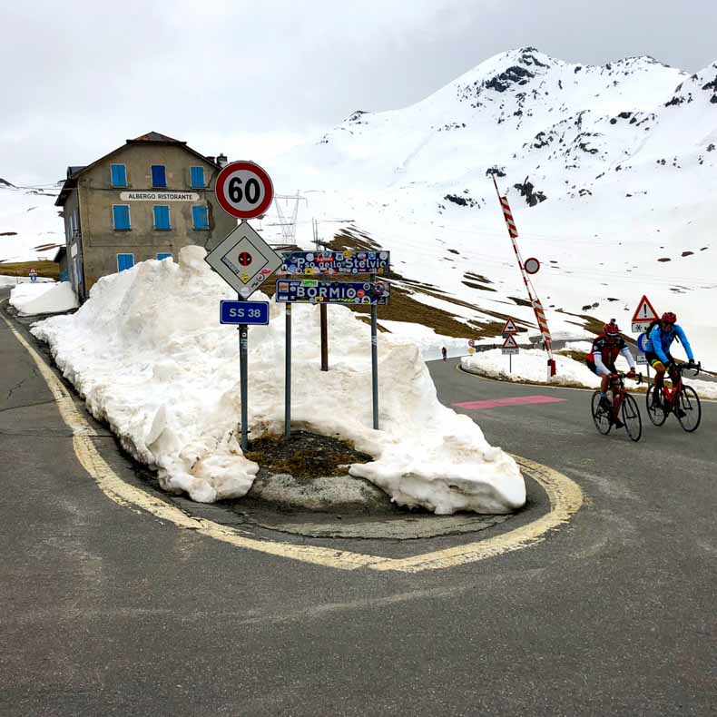 Two cyclists riding up the iconic Stelvio