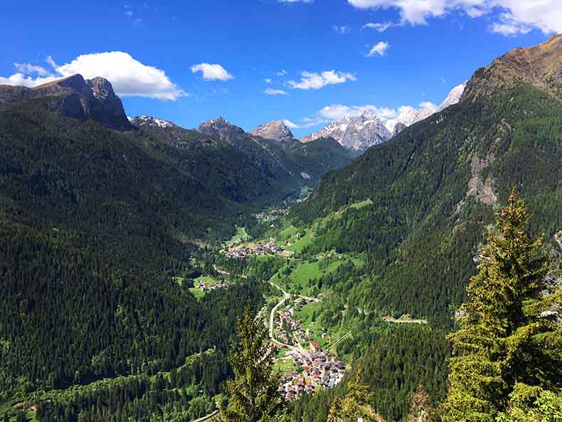 A village on the valley floor in the Dolomites